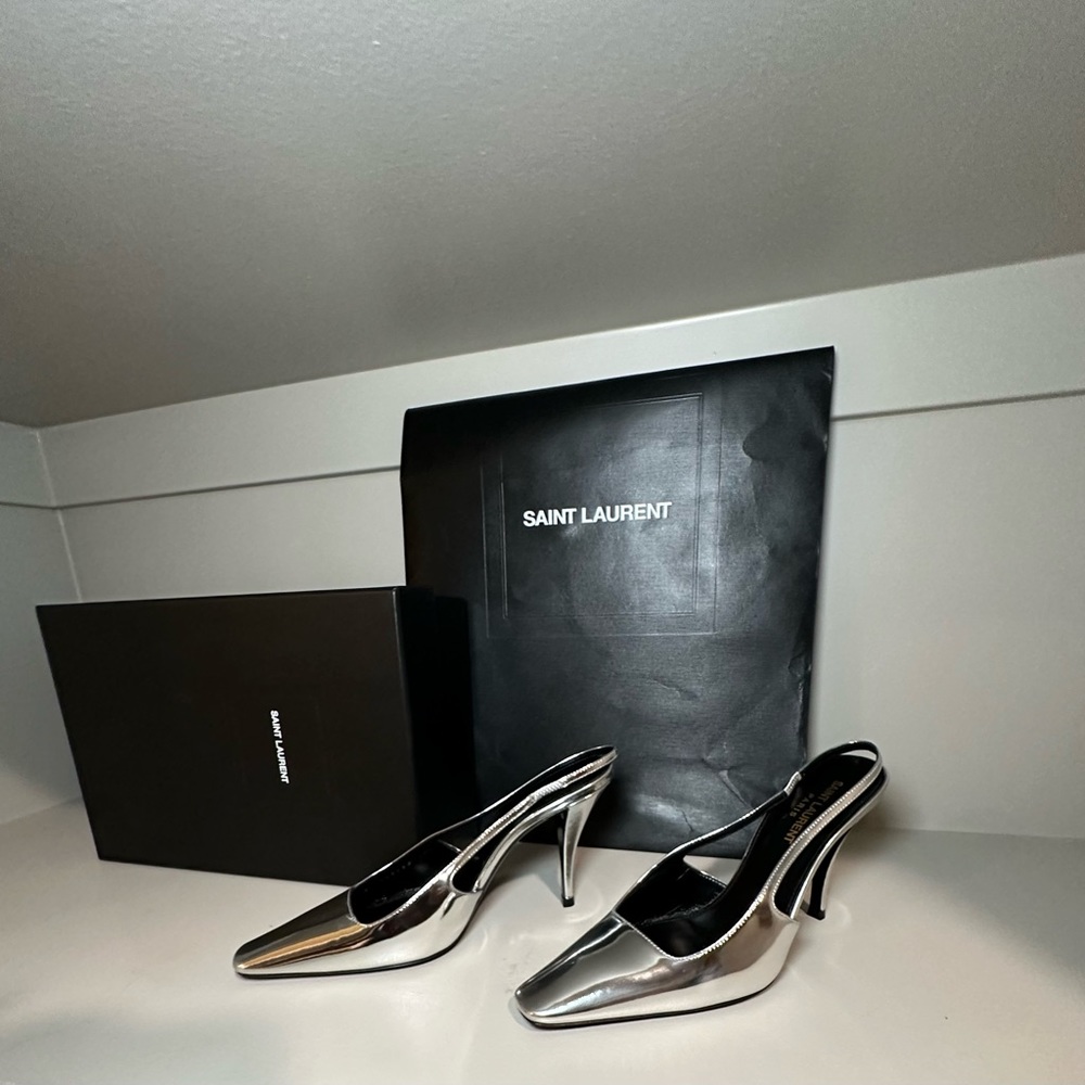 Saint Laurent silver slingbacks.